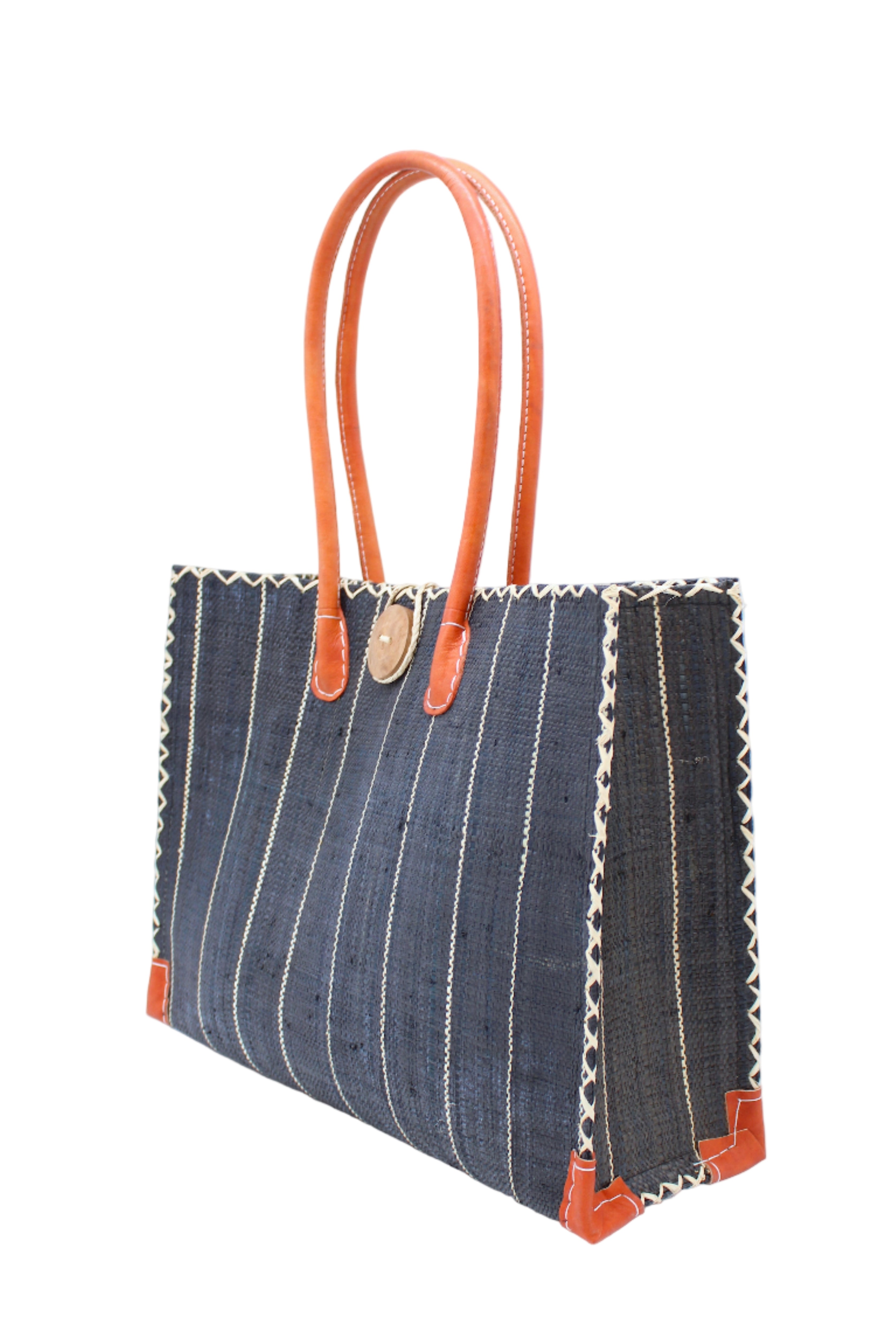 Side view Zafran Black Pinstripes Large Straw Beach Bag with Plastic Liner handmade loomed raffia tote in wide bands of black with narrow bands of natural straw color that make a vertical pinstripe pattern with assorted print plastic lining and leather handles xl bag - Shebobo