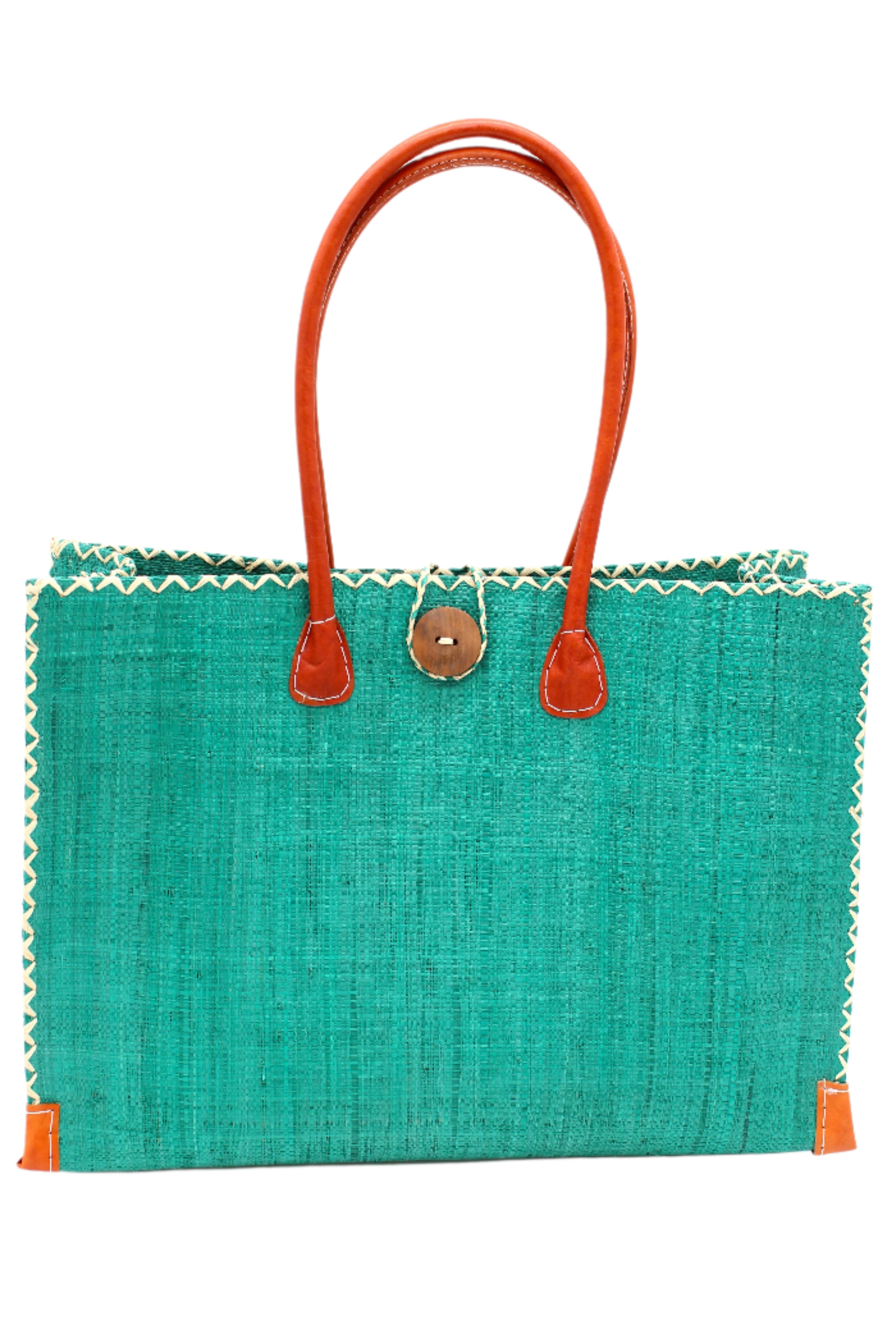 Zafran Straw Beach Bag with Plastic Liner handmade loomed raffia in a solid hue of Teal dark/blue/green with contrasting natural straw color cross stitch edge binding, wood button closure, and leather handles & feet plus assorted print plastic lining - Shebobo