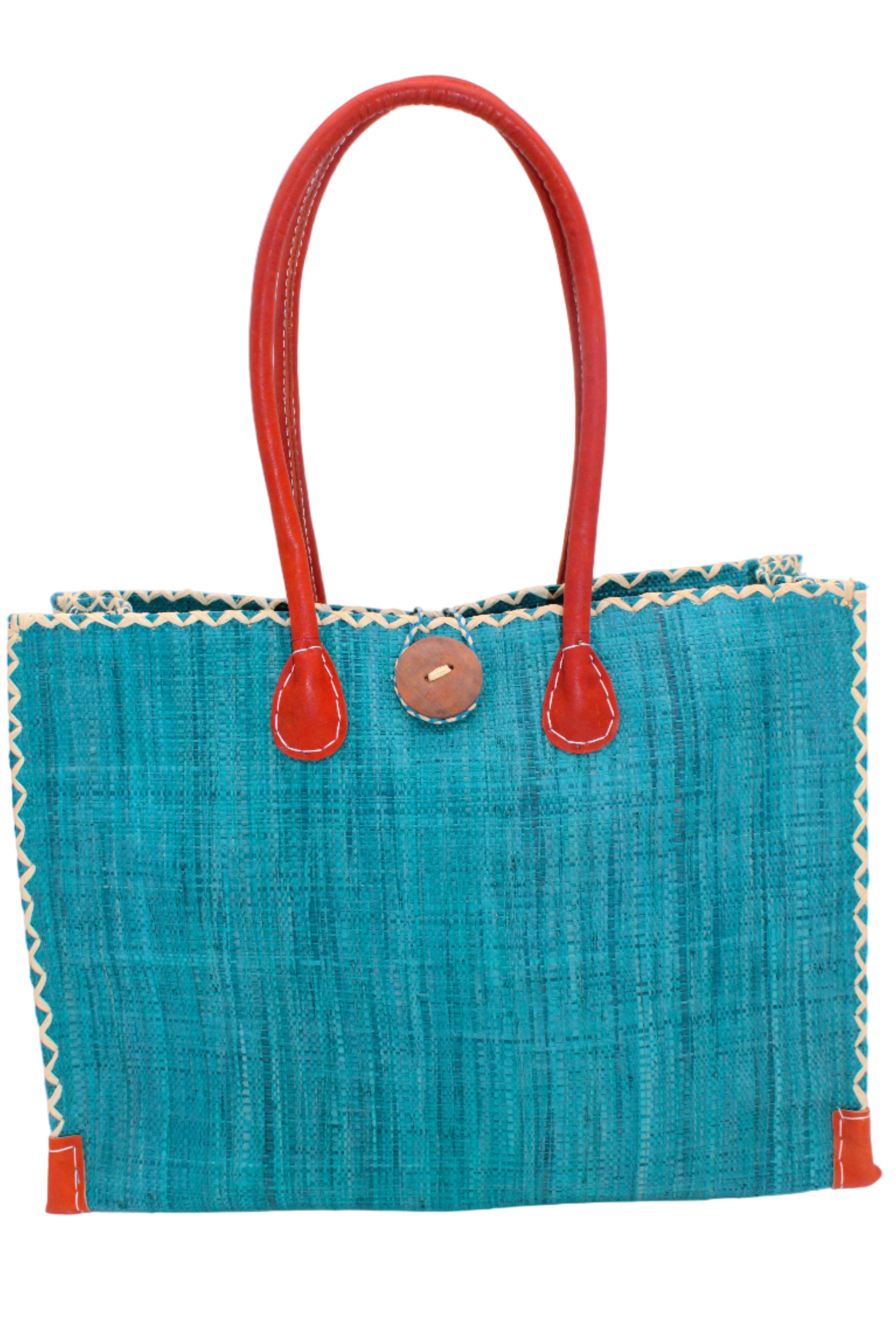 Zafran Straw Beach Bag with Plastic Liner handmade loomed raffia in a solid hue of Turquoise blue/green with contrasting natural straw color cross stitch edge binding, wood button closure, and leather handles & feet plus assorted print plastic lining - Shebobo