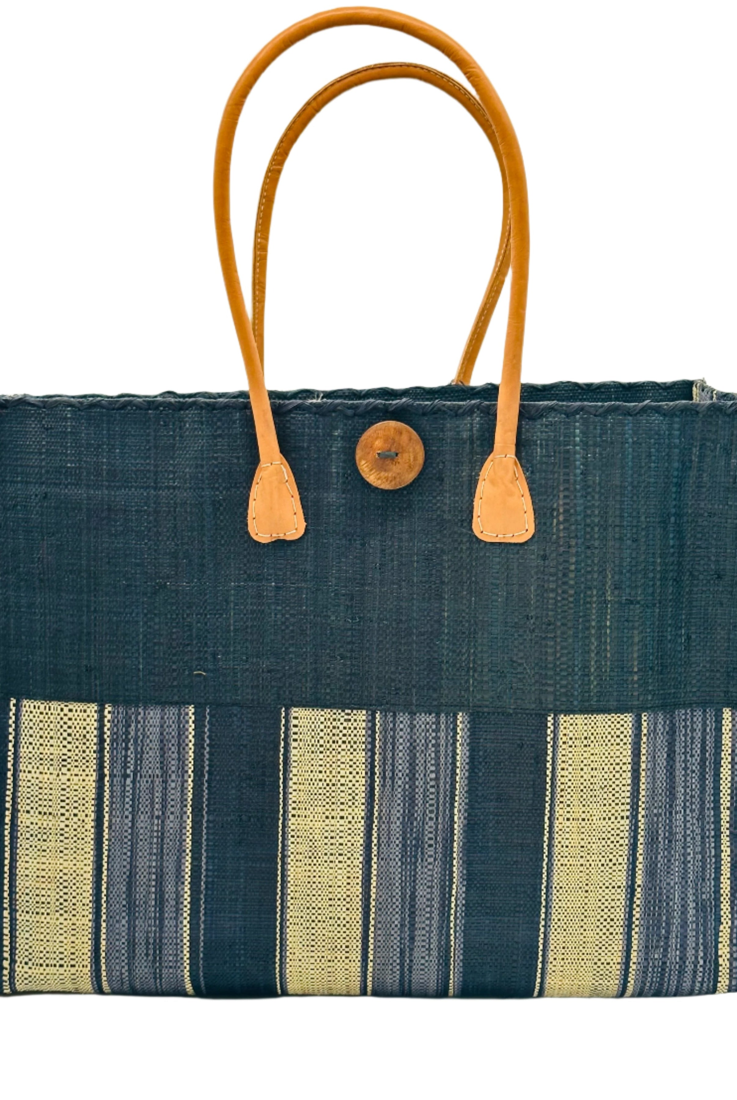 Zafran Two Tone Wide Stripe Black Swirl Straw Beach Bag handmade loomed raffia palm fiber in a solid hue of black on the top half of the bag and a multicolor multi-width vertical stripe pattern of black, grey, and natural straw color on the bottom half of the bag with leather handles and feet and matching crosshatch stitch edging shoulder bag - Shebobo