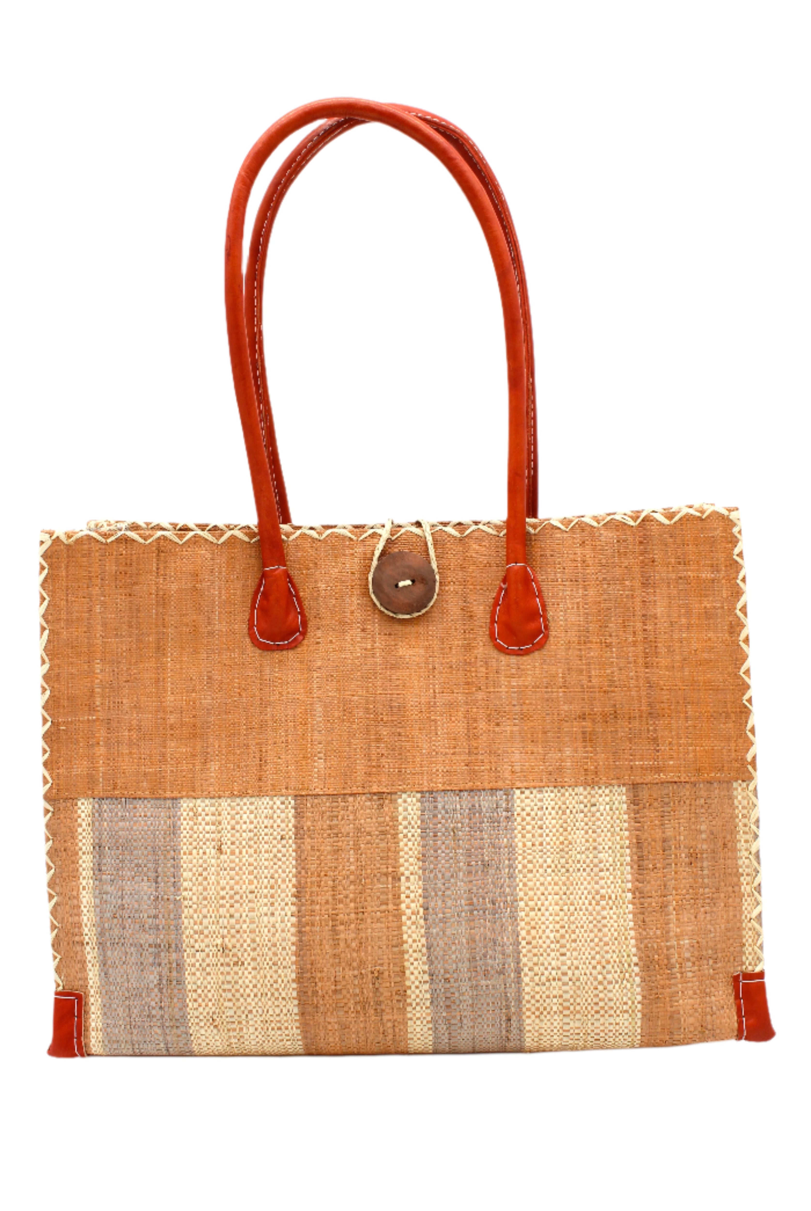 Zafran Two Tone Wide Stripe Blush Swirl Straw Beach Bag handmade loomed raffia palm fiber in a solid hue of blush orange/pink on the top half of the bag and a multicolor multi-width vertical stripe pattern of blush, grey, and natural straw color on the bottom half of the bag with leather handles and feet and matching crosshatch stitch edging shoulder bag - Shebobo