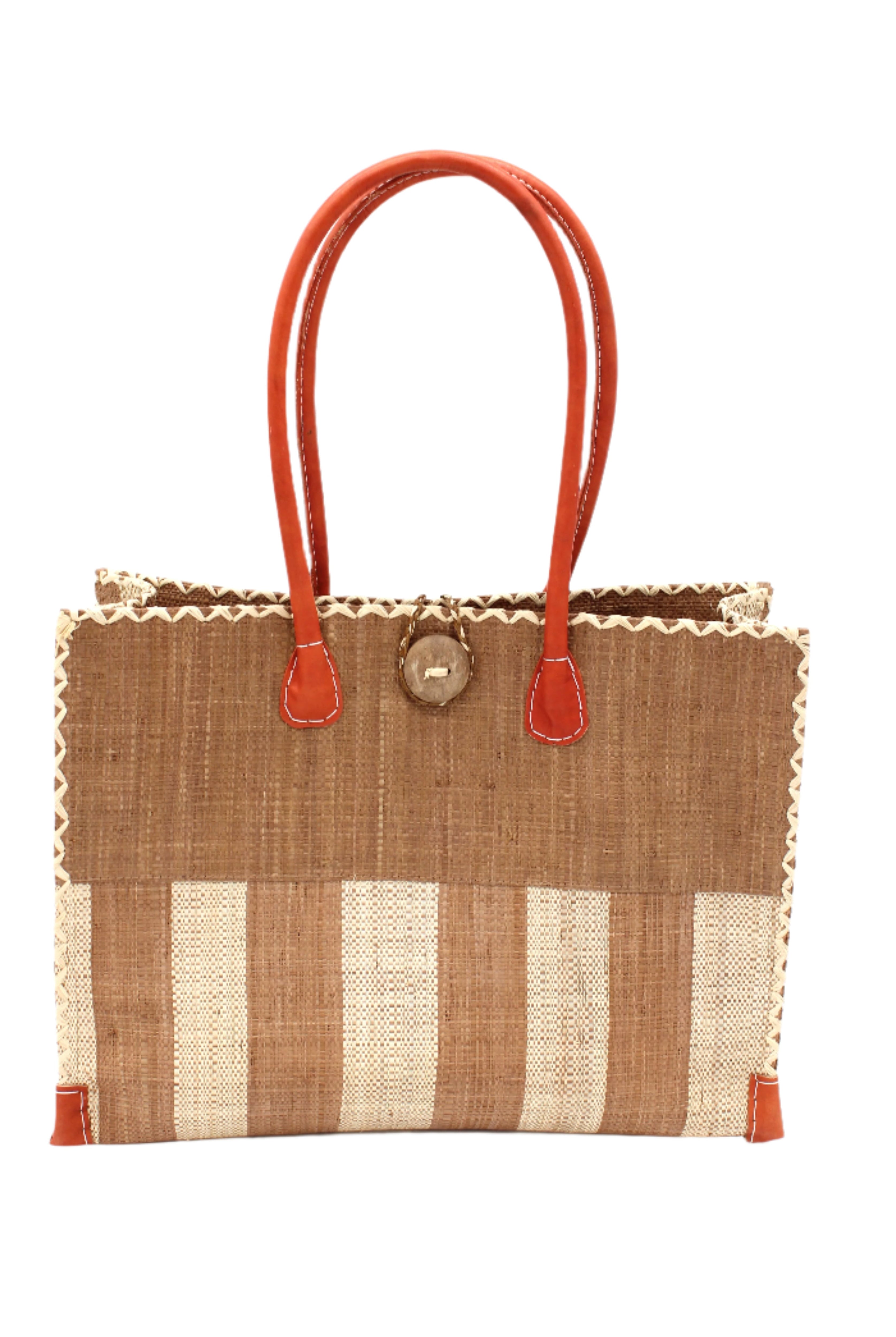 Zafran Two Tone Wide Stripe Cappuccino and Natural Straw Beach Bag handmade loomed raffia palm fiber in a solid hue of cappuccino light/brown/beige on the top half of the bag and a two tone even width vertical wide stripe pattern of cappuccino and natural straw color on the bottom half of the bag with leather handles and feet and matching crosshatch stitch edging shoulder bag - Shebobo