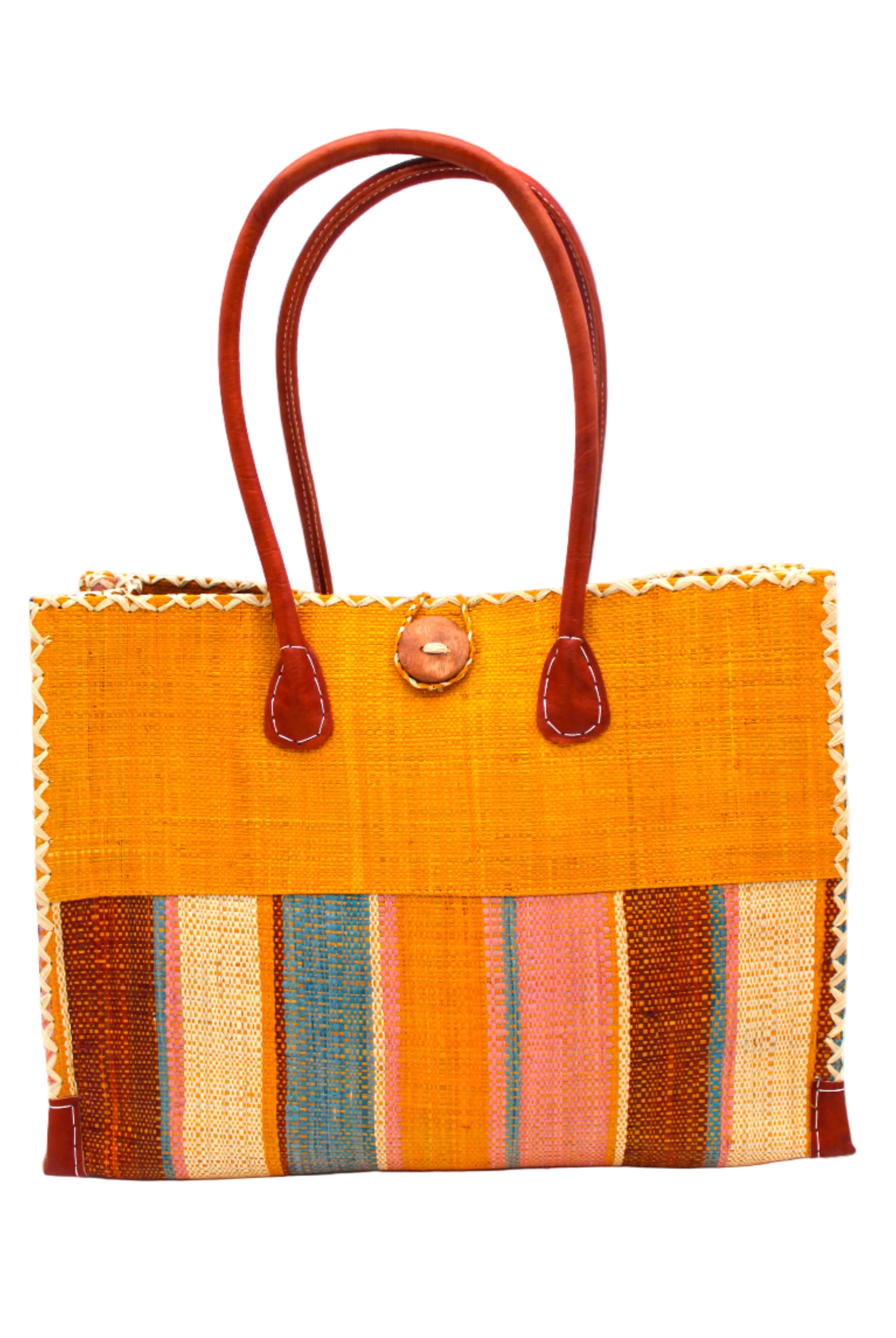 Zafran Two Tone Wide Stripe Pink Blue Swirl Straw Beach Bag handmade loomed raffia palm fiber in a solid hue of Saffron yellow/orange on the top half of the bag and a multicolor multi-width vertical stripe pattern of black, soft/light/baby pink, light blue, saffron, and natural straw color on the bottom half of the bag with leather handles and feet and matching crosshatch stitch edging shoulder bag - Shebobo