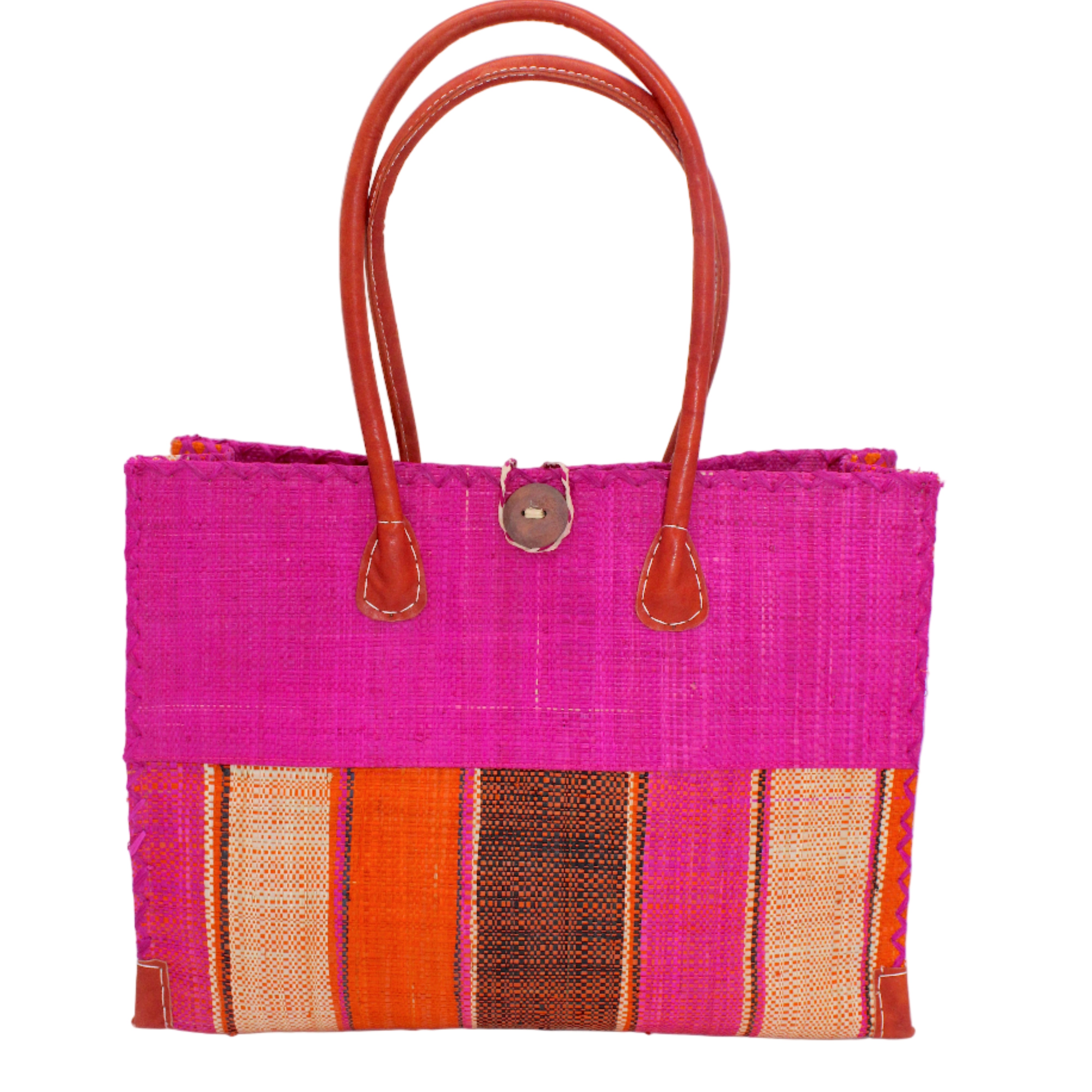 Zafran Two Tone Wide Stripe Whimsy Swirl Straw Beach Bag handmade loomed raffia palm fiber in a solid hue of Fuchsia hot/bright/barbie/pink on the top half of the bag and a multicolor multi-width vertical stripe pattern of black, coral red/orange, fuchsia, and natural straw color on the bottom half of the bag with leather handles and feet and matching crosshatch stitch edging shoulder bag - Shebobo
