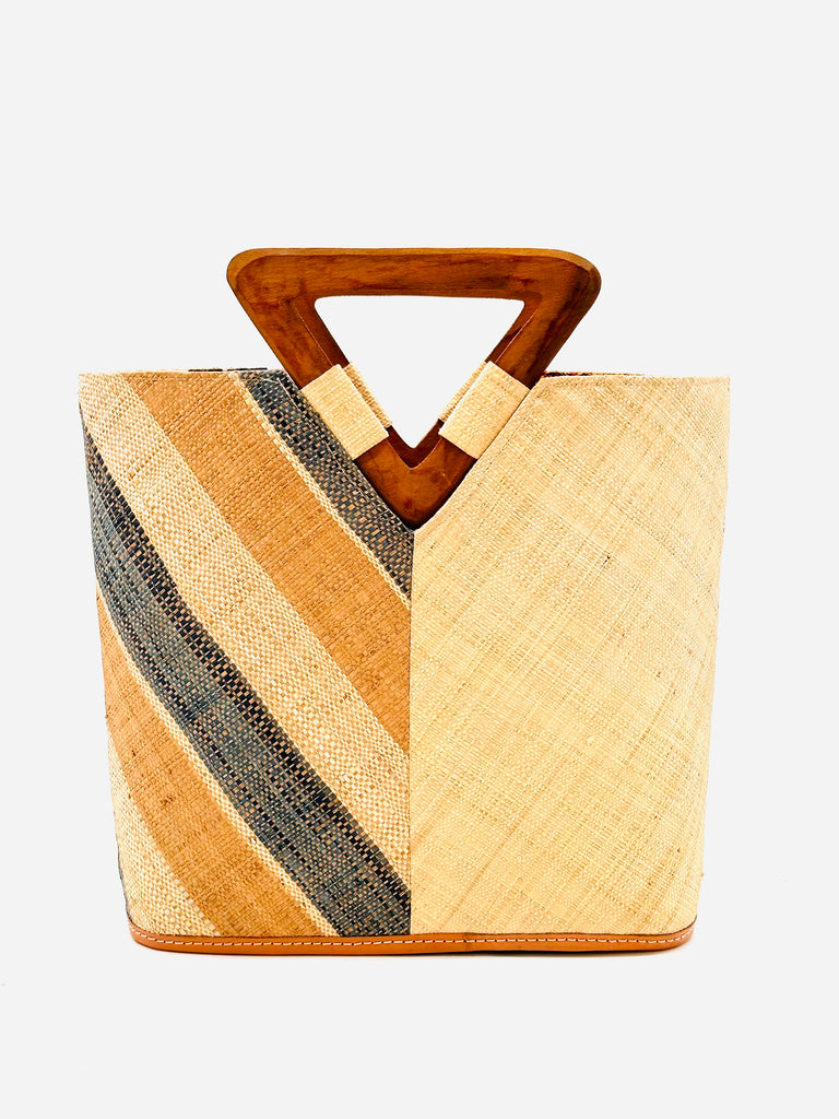 Zuki Two Tone Blush Swirl Straw Handbag With Wood Triangle Handle handmade loomed raffia vertically halved visually with one side of multicolor Blush pink/orange, grey, and natural multi width stripe pattern on a diagonal with the other half solid natural boho chic purse bag - Shebobo