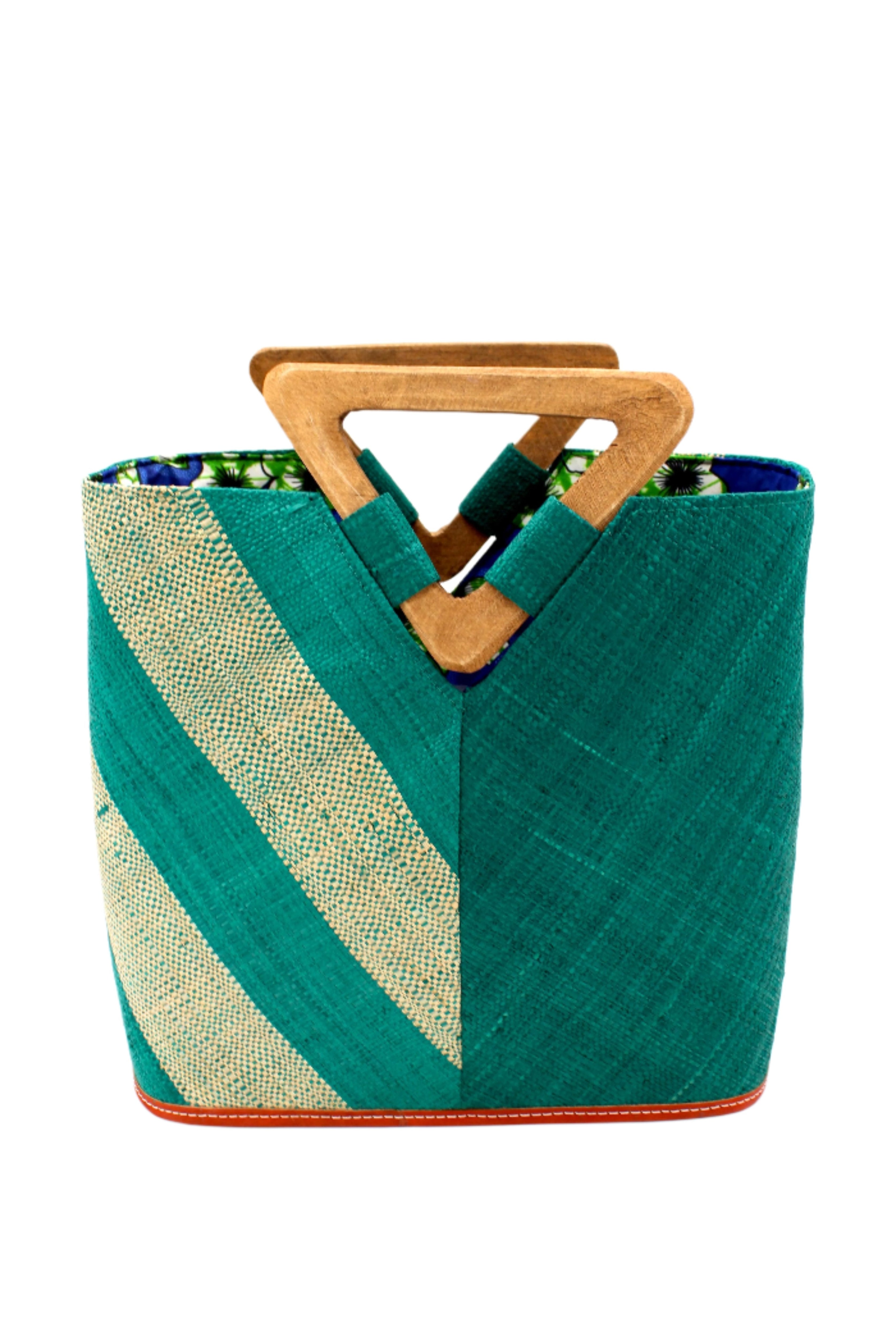 Zuki Two Tone Teal Straw Handbag With Wood Triangle Handle handmade loomed raffia palm fiber in a two tone pattern with the left half of the bag even width stripes of teal dark/blue/green and natural straw color oriented as a diagonal stripe and the right half of the bag a solid hue of teal with carved wood handles - Shebobo
