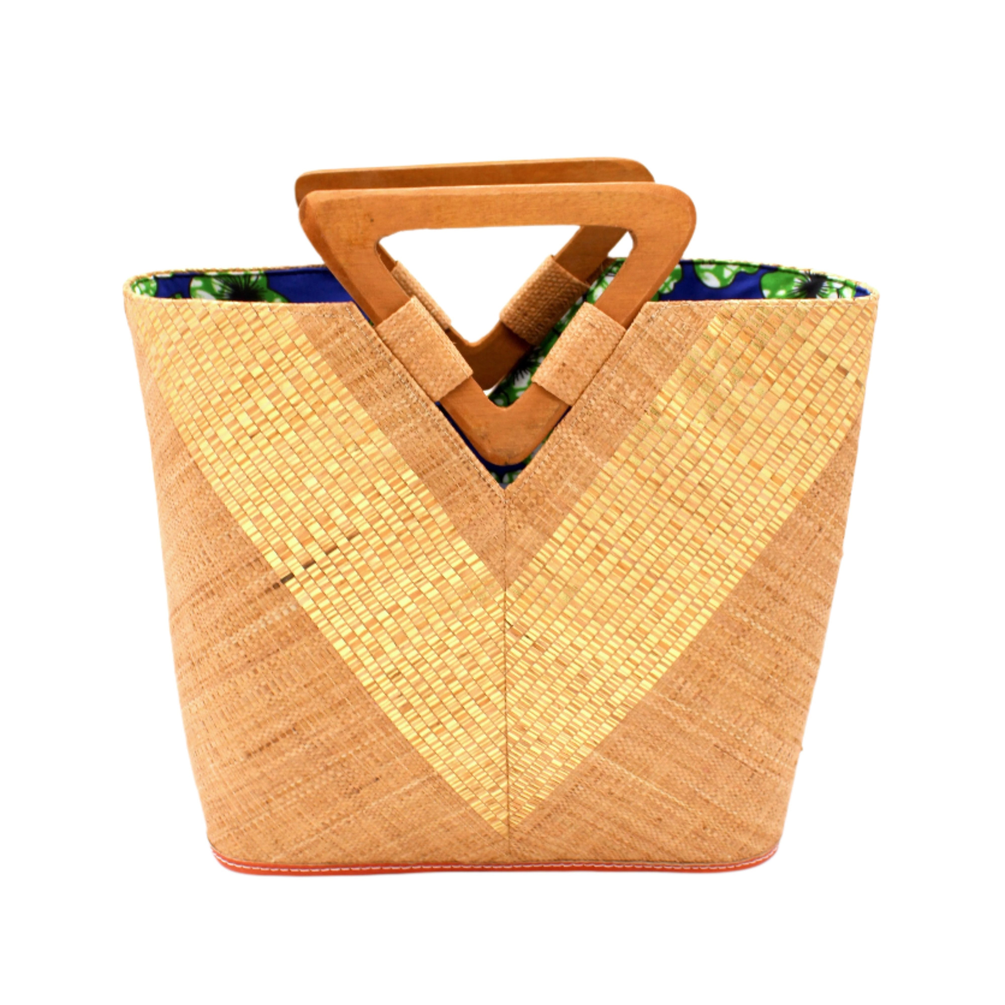 Zuki Wynwood Cappuccino Straw Handbag with Metallic Detailing & Wood Triangle Handle handmade loomed raffia palm fiber in a solid hue of cappuccino light/brown/beige with incorporated vegan leather gold metallic strands in a V pattern across the front and back of the bag with assorted print African wax cloth liners and carved wooden triangle handle purse - Shebobo
