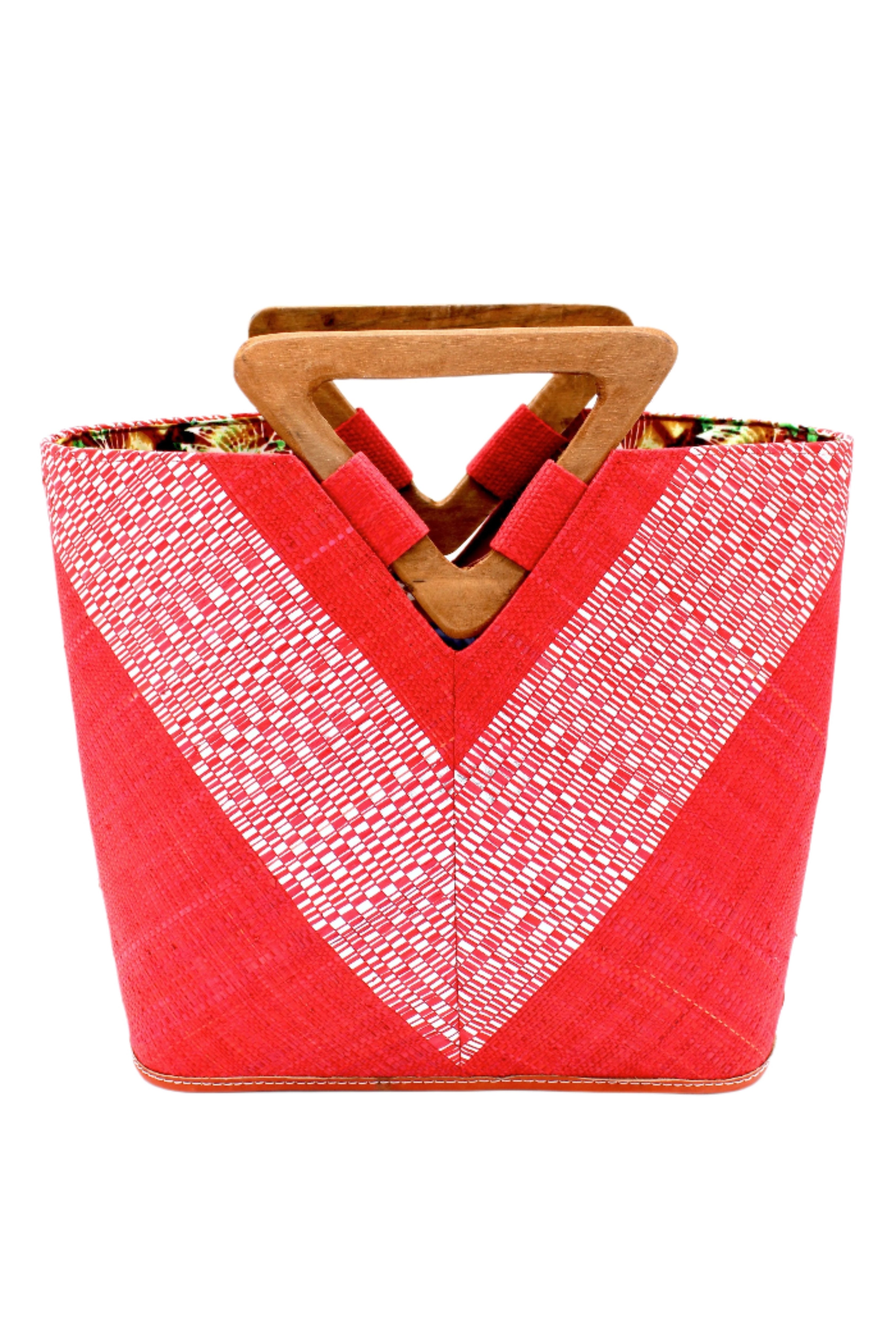 Zuki Wynwood Red Straw Handbag with Metallic Detailing & Wood Triangle Handle handmade loomed raffia palm fiber in a solid hue of red with incorporated vegan leather silver metallic strands in a V pattern across the front and back of the bag with assorted print African wax cloth liners and carved wooden triangle handle purse - Shebobo