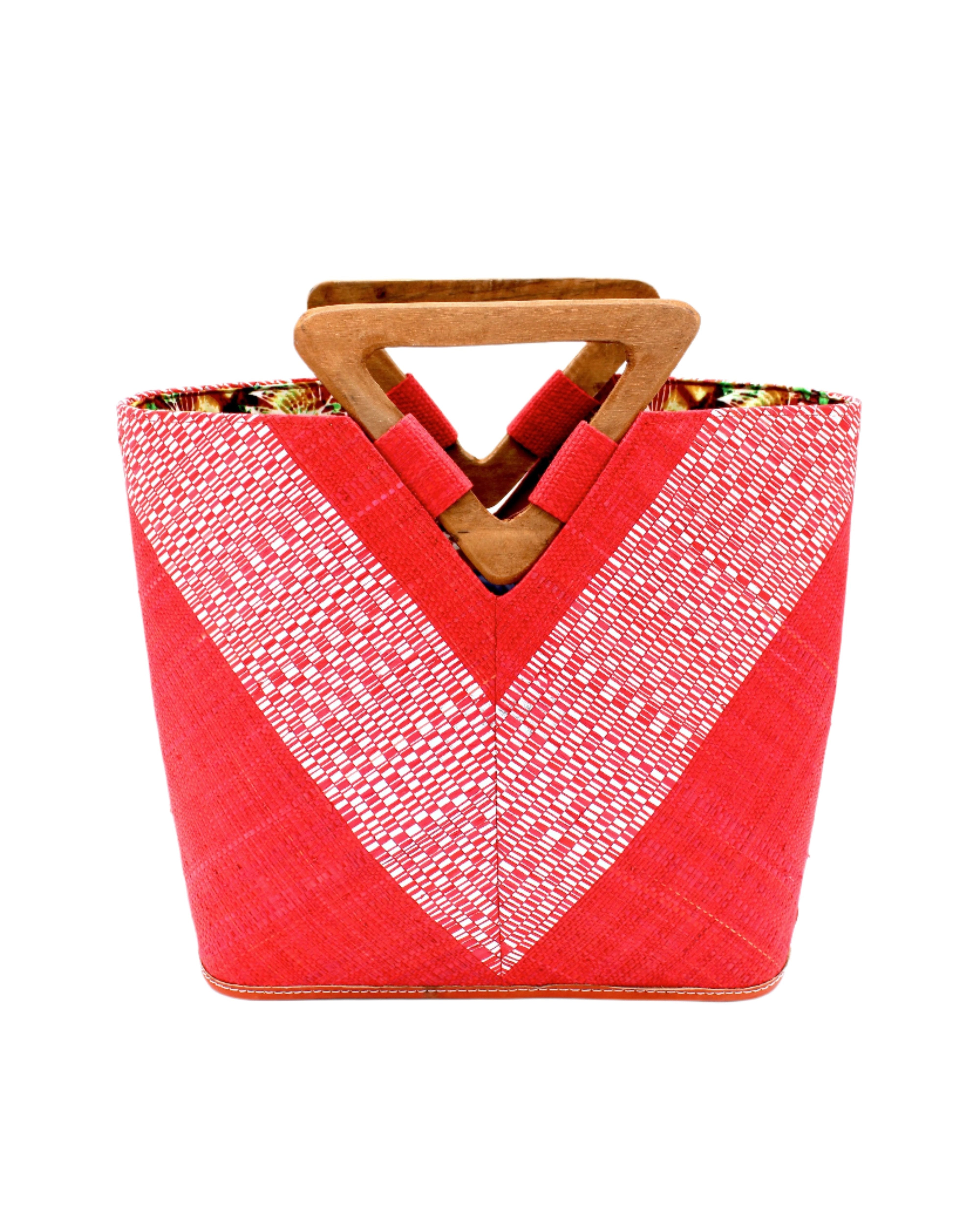 Zuki Wynwood Red Straw Handbag with Metallic Detailing & Wood Triangle Handle handmade loomed raffia palm fiber in a solid hue of red with incorporated vegan leather silver metallic strands in a V pattern across the front and back of the bag with assorted print African wax cloth liners and carved wooden triangle handle purse - Shebobo
