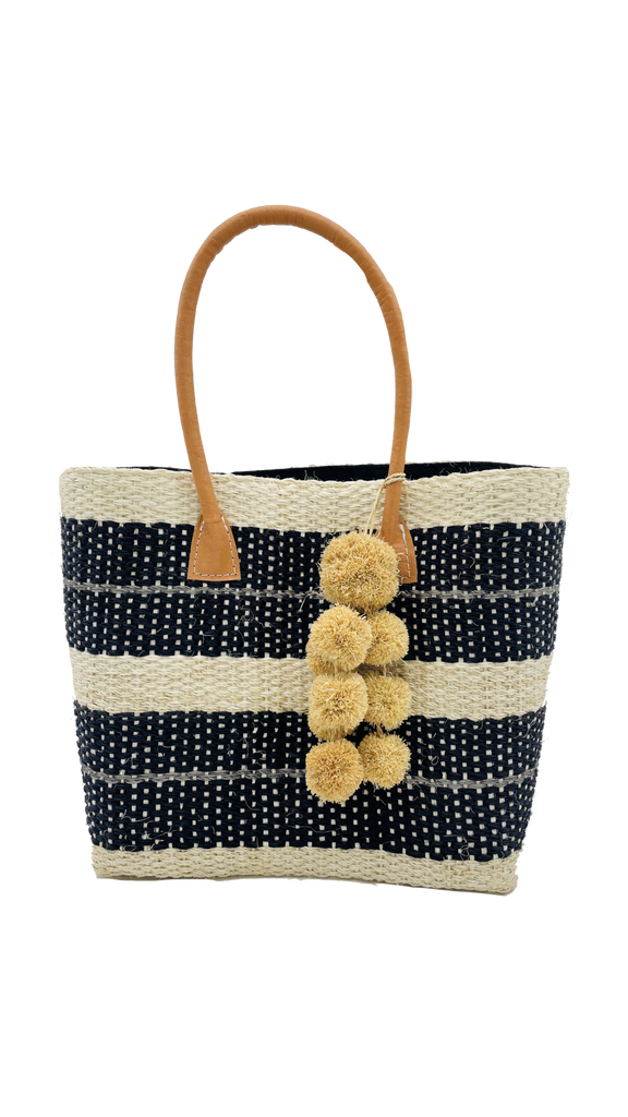 Imperial sisal basket natural straw color, black, and grey stripe pattern woven bag with raffia pompom charm embellishment handbag - Shebobo