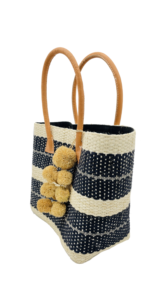 Imperial woven sisal basket handbag side view black, natural, and grey stripes with waterfall pompom charm - Shebobo