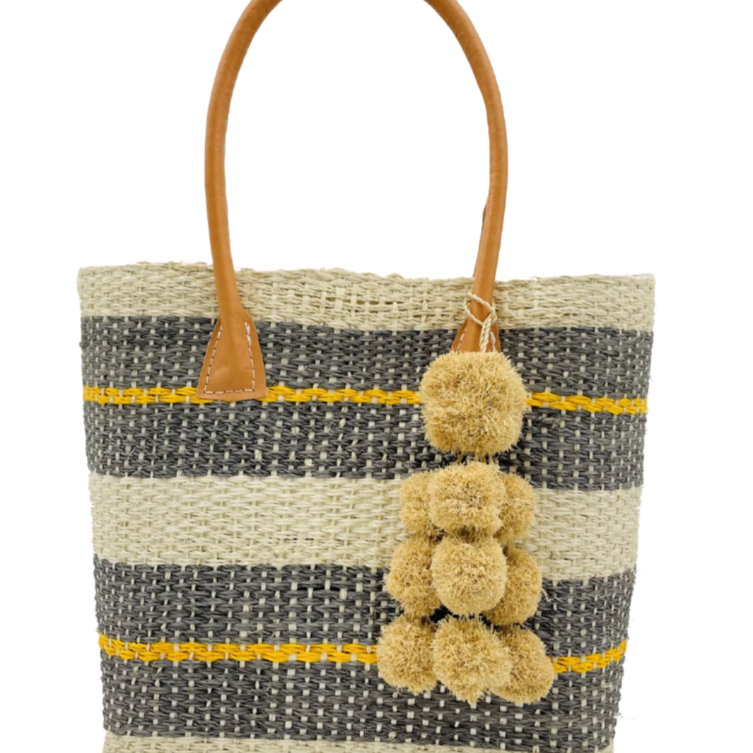 Imperial Handbag natural sisal fiber in natural straw color, grey, and saffron yellow horizontal multi-width stripe pattern handmade woven basket with raffia waterfall pompom charm embellishment - Shebobo
