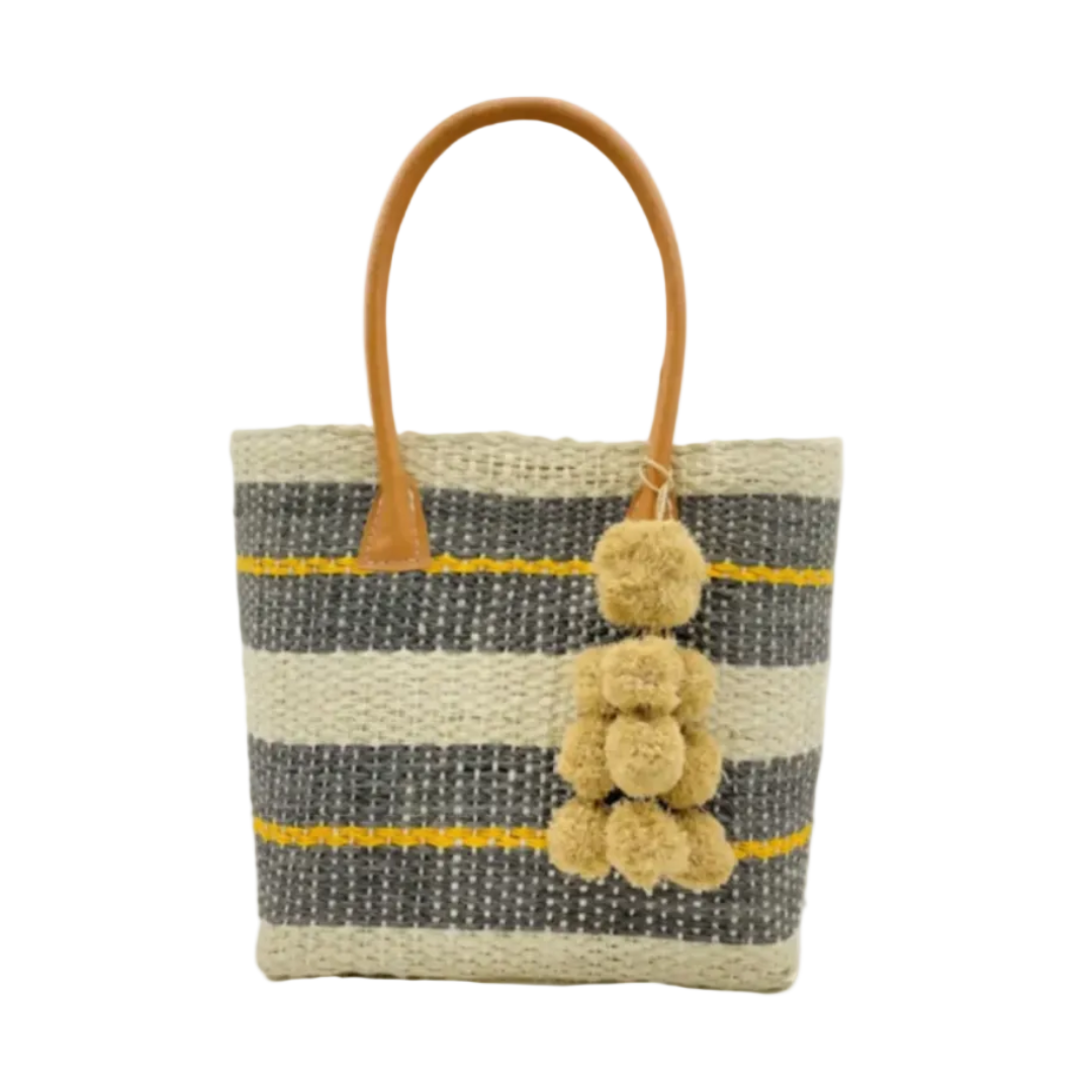 Imperial Handbag natural sisal fiber in natural straw color, grey, and saffron yellow horizontal multi-width stripe pattern handmade woven basket with raffia waterfall pompom charm embellishment - Shebobo