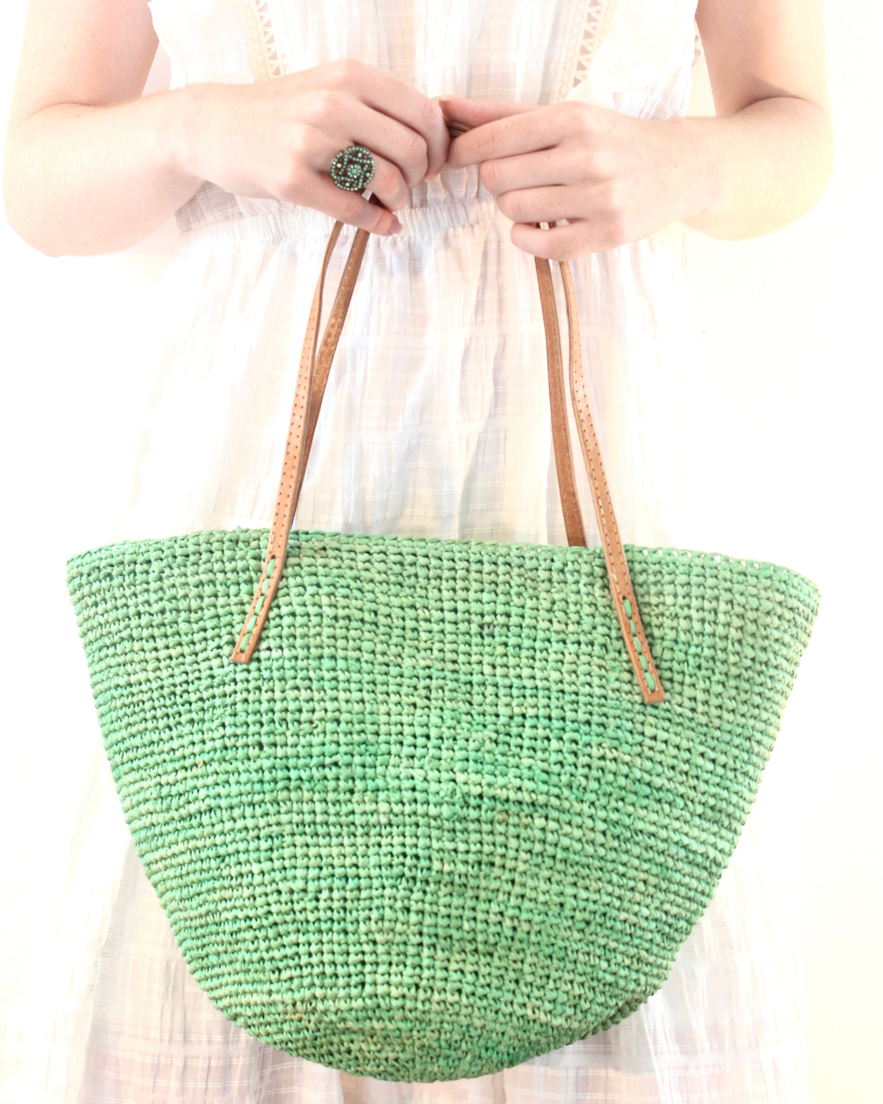 Model wearing Tika mint green hand crochet raffia straw handbag purse with leather handles bag - Shebobo