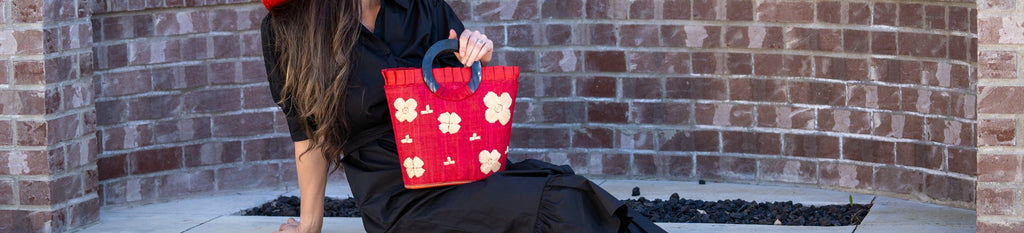 Model wearing Bebe Fuchsia Pink Bucket Handbag with Oversized Bamboo Handles Handmade loomed raffia purse - Shebobo