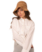 Model wearing 2.5" Brim Taylor Cappuccino Crochet Bucket Straw Hat with Zebra Stripes handmade raffia palm fiber in a two tone color combination of horizontal short stripes that create a dash pattern around the hat in cappuccino light brown with natural straw color - Shebobo