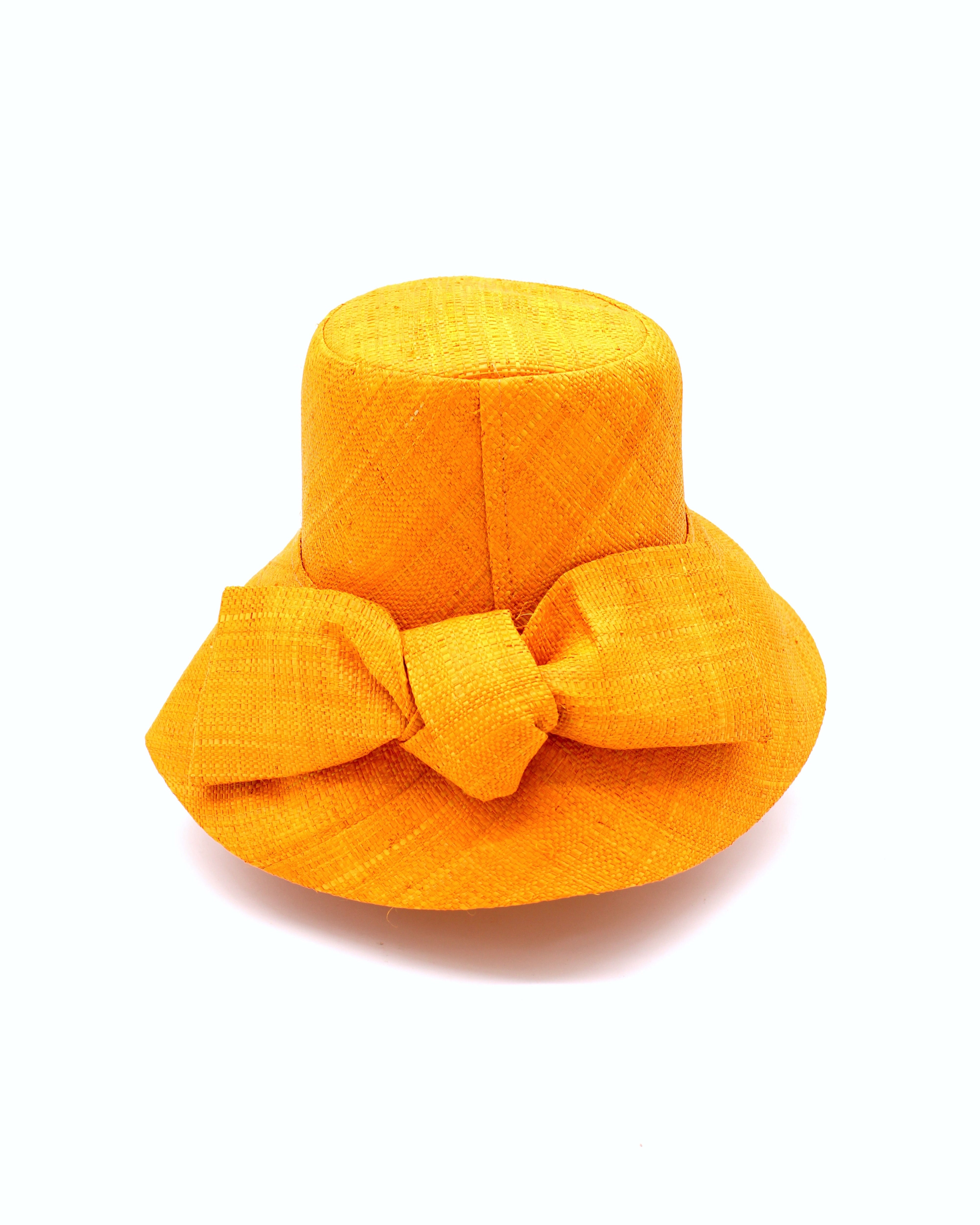Cara Saffron big bow embellishment handmade loomed raffia in a solid hue of saffron yellow/orange straw bucket style cloche sun hat with matching oversized bow - Shebobo