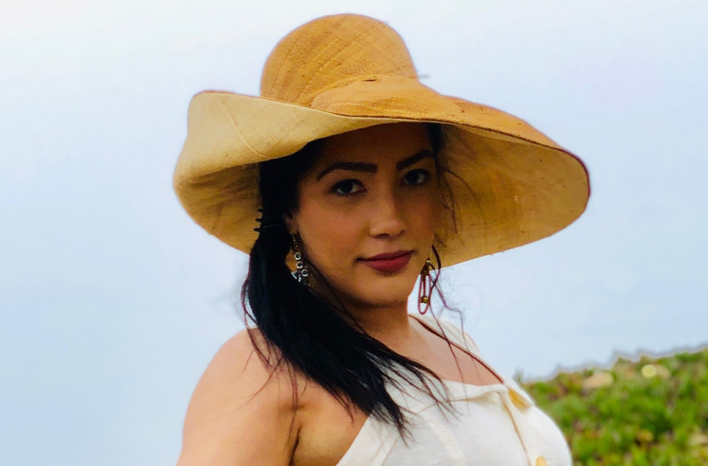Model wearing  7 inch Brim Two Tone Cinnamon Straw Hat handmade loomed raffia color block pattern of the top half cinnamon/tobacco/brown and the bottom half natural straw color - Shebobo