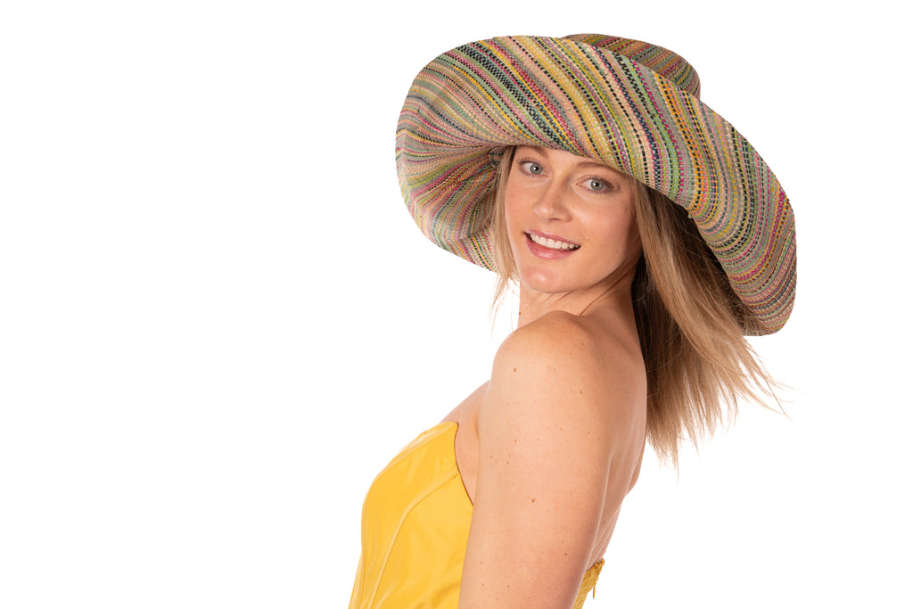 Model wearing 7" Wide Brim Seafoam Multi Melange Packable Straw Sun Hat multicolor heather pattern of seafoam blue/green, lime green, turquoise blue, yellow, navy blue, pink, fuchsia, coral orange/red, natural straw color, etc. - Shebobo