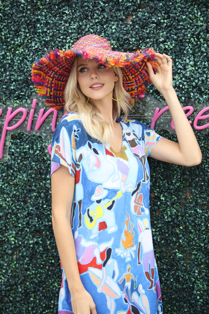 Model wearing 5" Brim Kat Raspberry Multi Multicolor Straw Sun Hats with Raw Fringe Edge handmade woven raffia in a crosshatch pattern of fuchsia pink, yellow, pink, caramel brown, purple, blue, bordeaux, turquoise, black, orange, and natural straw color with wide brim and hand brushed edge embellishment - Shebobo