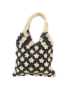 Amalie Two Tone Daisy Flower Crochet Straw Handbag handmade crochet mini flower buds from crochet natural raffia palm fiber in an alternating colored pattern of black and natural straw color with black internal liner and natural woven handles purse - Shebobo