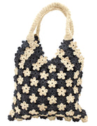 Amalie Two Tone Daisy Flower Crochet Straw Handbag handmade crochet mini flower buds from crochet natural raffia palm fiber in an alternating colored pattern of black and natural straw color with black internal liner and natural woven handles purse - Shebobo