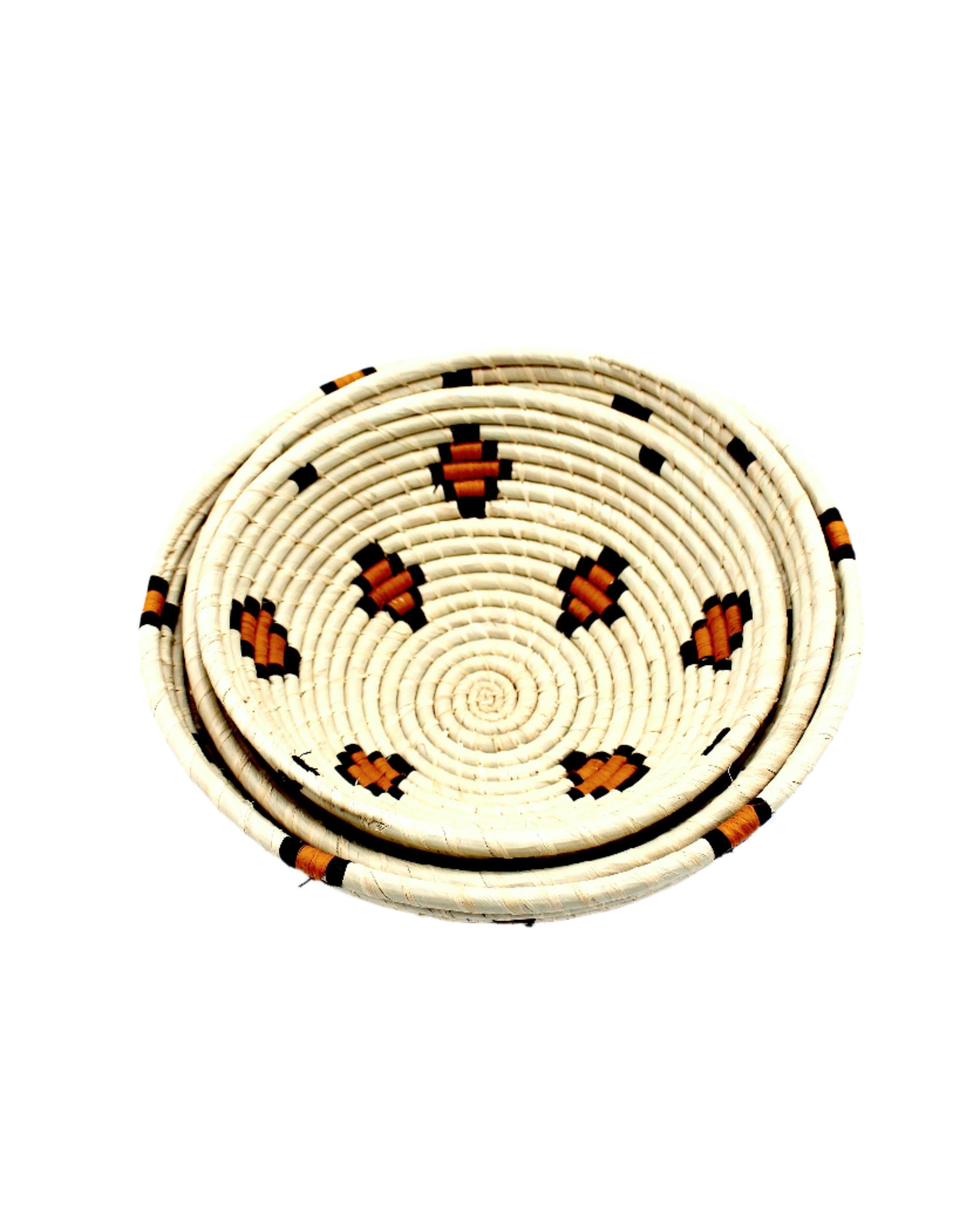 Detail view Amara Raffia Straw Decor Display Basket Bowls: Set of 3 handmade woven natural raffia palm fiber in a crochet loop technique concentric coiled circular pattern with natural straw color centered in the bottom with diamond pattern of saffron yellow/orange edged in black around the sides of the bowl with natural straw color base set of small, medium, and large straw display bowls - Shebobo