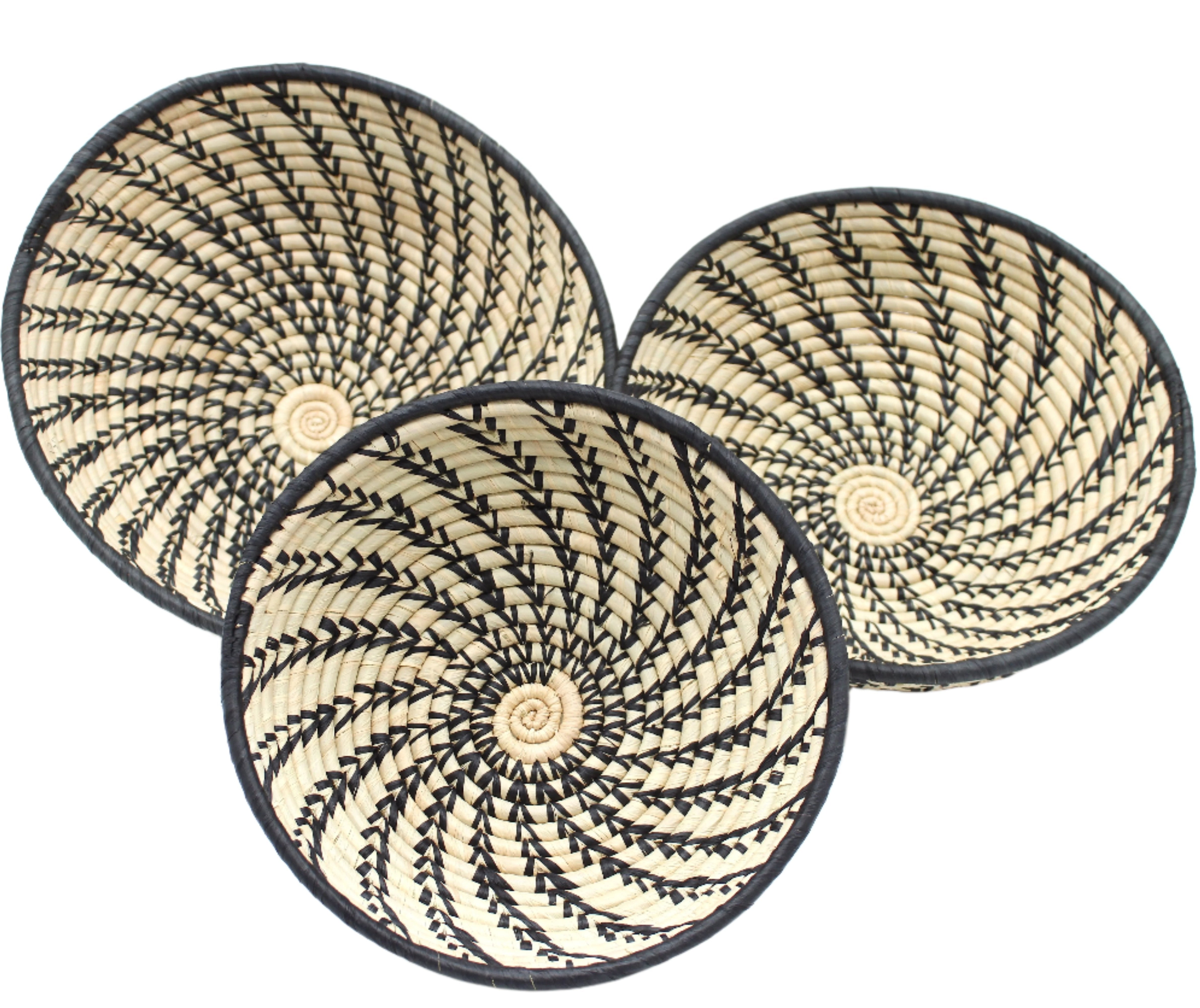 Amara Raffia Straw Decor Display Basket Bowls: Set of 3 handmade woven natural raffia palm fiber in a crochet loop technique concentric coiled circular pattern with natural straw color centered in the bottom and that go up the sides of the bowls with contrasting black swirl stitch pattern and matching black rim/edge set of small, medium, and large straw display bowls - Shebobo