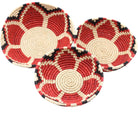 Amara Raffia Straw Decor Display Basket Bowls: Set of 3 handmade woven natural raffia palm fiber in a crochet loop technique concentric coiled circular pattern with natural straw color centered in the bottom with red, natural, and black geometric floral design pattern up the sides of the bowls set of small, medium, and large straw display bowls - Shebobo