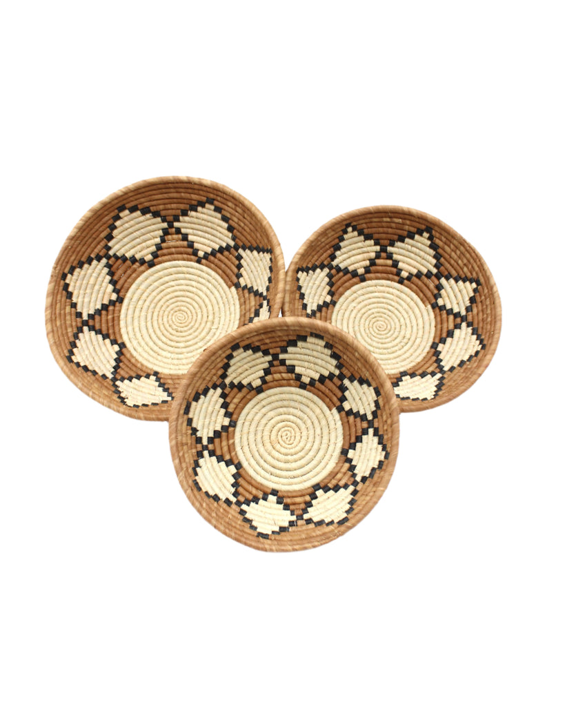 Amara Raffia Straw Decor Display Basket Bowls: Set of 3 handmade woven natural raffia palm fiber in a crochet loop technique concentric coiled circular pattern with natural straw color centered in the bottom with cinnamon/tobacco/brown sides and natural diamond with black edges pattern set of small, medium, and large straw display bowls - Shebobo