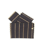Amelia Set of 3 Black Nesting Zippered Straw Clutches Pinstripe Pattern handmade loomed raffia in wide vertical bands of black with narrow bands of natural straw color with matching zipper and braided zipper pull with cross stitch edging in three sizes of small, medium, and large - Shebobo