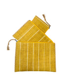 Amelia Set of 3 Saffron Nesting Zippered Straw Clutches Pinstripe Pattern handmade loomed raffia in wide vertical bands of saffron yellow with narrow bands of natural straw color with matching zipper and braided zipper pull with cross stitch edging in three sizes of small, medium, and large - Shebobo