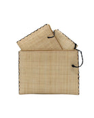 Amelia Set of 3 Natural straw color Nesting Zippered Straw Clutches Solid Colors handmade loomed raffia in a solid hue with matching zipper and braided zipper pull with cross stitch edging in three sizes of small, medium, and large - Shebobo