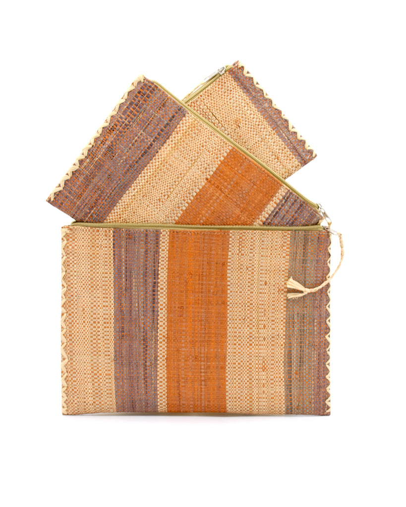 Amelia Set of 3 Nesting Zippered Straw Clutches Blush Swirl Multicolor Stripe Pattern handmade loomed raffia in multiple widths of vertical stripes in natural, blush orange/pink, and grey with matching zipper and braided zipper pull with cross stitch edging in three sizes of small, medium, and large - Shebobo