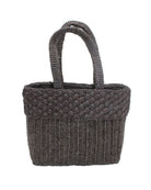 Anna Petal Pattern Crochet Straw Basket Handbag handmade natural raffia palm fiber in a solid hue of Black crochet in multiple textures resulting in a subtle pattern of vertical linked bands on the bottom 2/3 of the bag, and a floral petal or shell pattern on the upper third with rolled panel of links making up the handles Beach Bag Purse - Shebobo