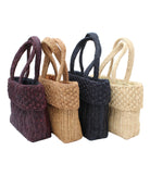 Anna Petal Pattern Crochet Straw Basket Handbag handmade natural raffia palm fiber in a solid hues crochet in multiple textures resulting in a subtle pattern of vertical linked bands on the bottom 2/3 of the bag, and a floral petal or shell pattern on the upper third with rolled panel of links making up the handles Beach Bag Purse - Shebobo