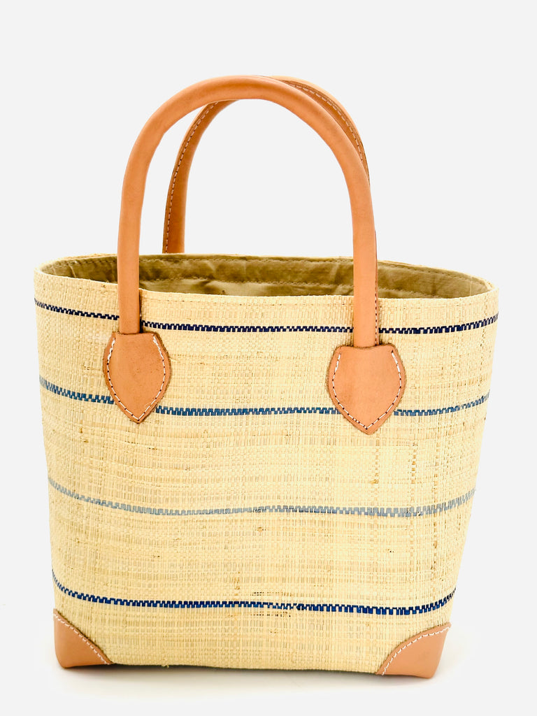 Augustine pinstripes straw basket bag handmade loomed raffia in natural wide horizontal bands with multicolor blues of turquoise, navy, light, and dark small bands running through in a stripe pattern with leather accents and handles handbag purse - Shebobo