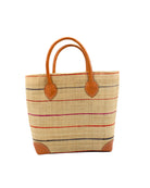 Augustine pinstripes straw basket bag handmade loomed raffia in natural wide horizontal bands with multicolor coral red/orange, fuchsia pink, and navy blue small bands running through in a stripe pattern with leather accents and handles handbag purse - Shebobo