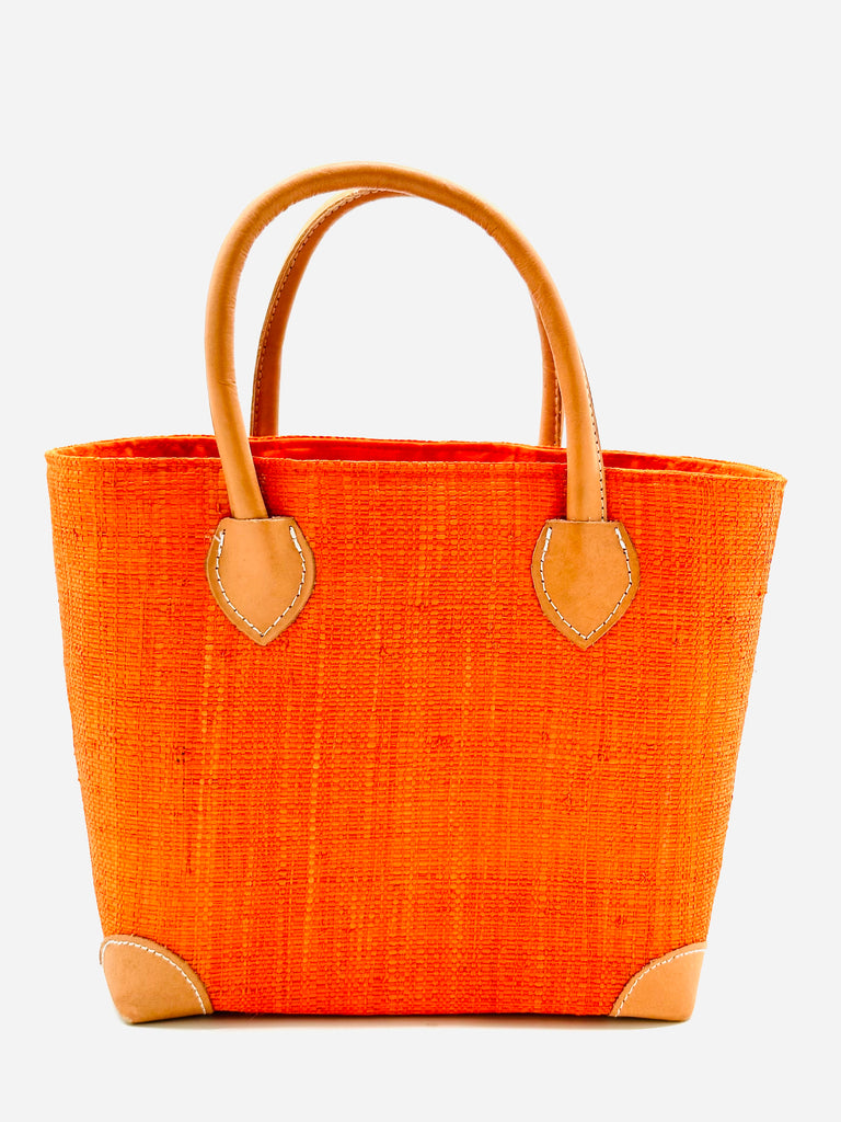 Augustine Straw Basket Bag handmade loomed raffia handbag with leather corners and handles in coral orange/red - Shebobo