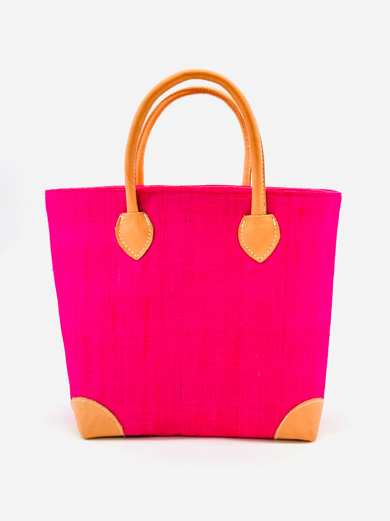 Augustine Straw Basket Bag handmade loomed raffia handbag with leather corners and handles in fuchsia pink - Shebobo