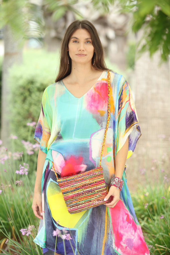 Model wearing Barbados multicolor handmade crochet raffia crossbody bag bright purse - Shebobo *Dress by Kikisol