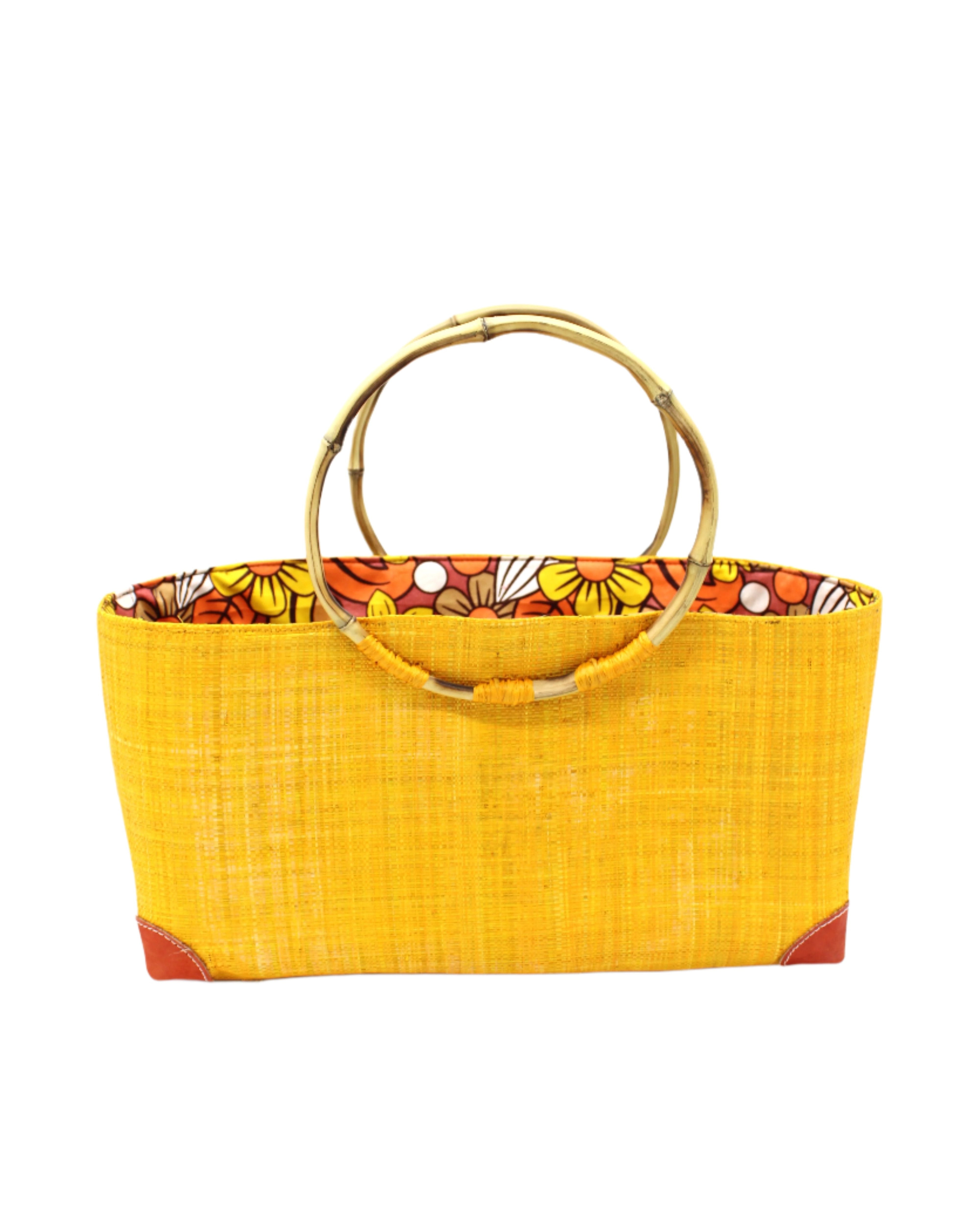 Bebe Straw Handbag with Bamboo Handle handmade loomed natural raffia palm fiber in a solid hue of saffron orange/yellow with molded circular bamboo handles, leather feet, and assorted print African wax-cloth fabric liner - Shebobo