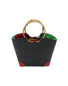 Betty Straw Bucket Bag with Bamboo Handles handmade loomed natural raffia palm fiber in a solid hue of black with circular bamboo handles, leather feet, and colorful African Print wax cloth liner handbag purse tote - Shebobo