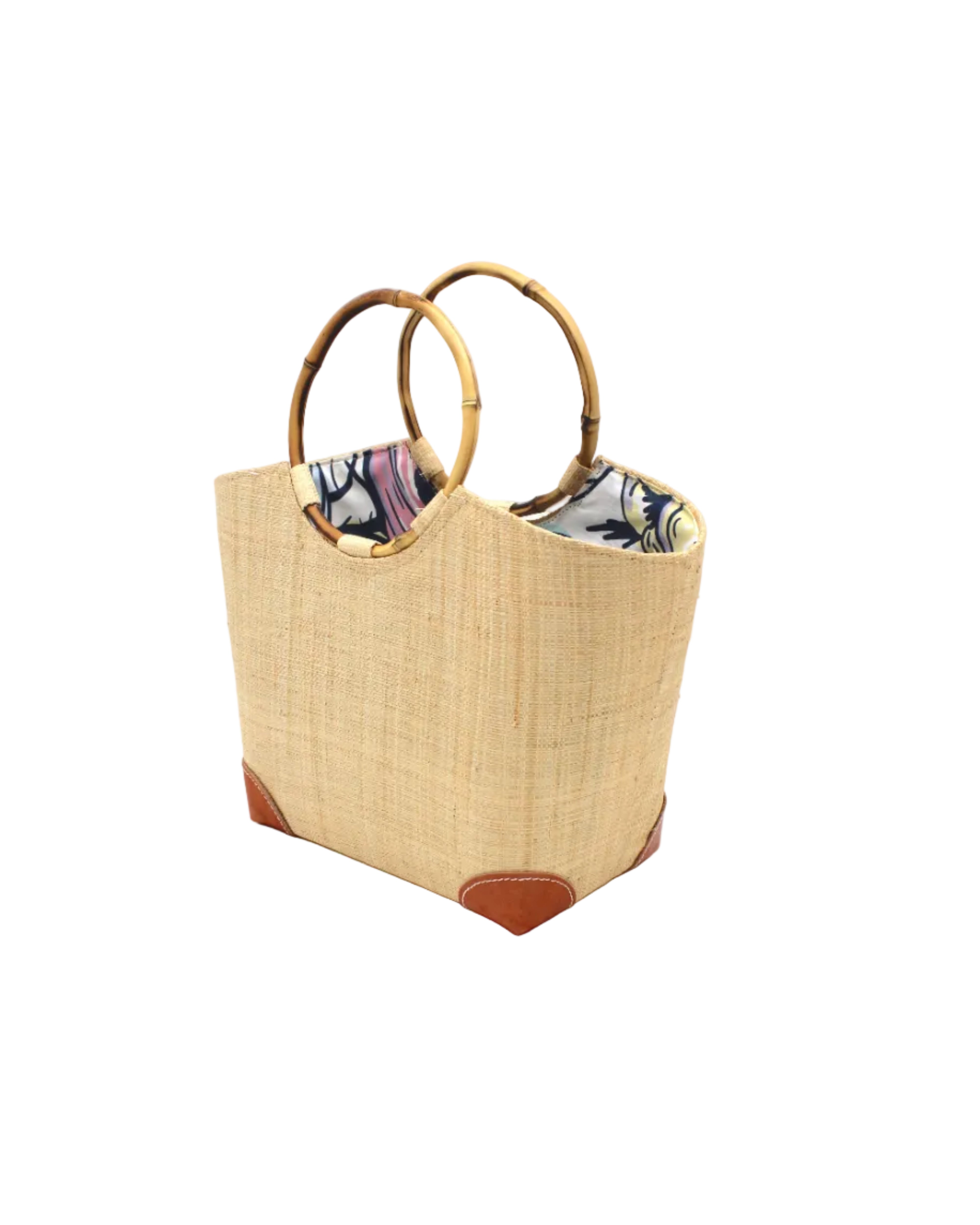 Side view Betty Straw Bucket Bag with Bamboo Handles handmade loomed natural raffia palm fiber in a solid hue of natural straw color with circular bamboo handles, leather feet, and colorful African Print wax cloth liner handbag purse tote - Shebobo