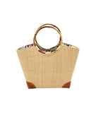 Betty Straw Bucket Bag with Bamboo Handles handmade loomed natural raffia palm fiber in a solid hue of natural straw color with circular bamboo handles, leather feet, and colorful African Print wax cloth liner handbag purse tote - Shebobo