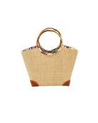 Betty Straw Bucket Bag with Bamboo Handles handmade loomed natural raffia palm fiber in a solid hue of natural straw color with circular bamboo handles, leather feet, and colorful African Print wax cloth liner handbag purse tote - Shebobo