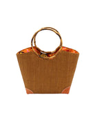 Betty Straw Bucket Bag with Bamboo Handles handmade loomed natural raffia palm fiber in a solid hue of tobacco cinnamon/dark/brown with circular bamboo handles, leather feet, and colorful African Print wax cloth liner handbag purse tote - Shebobo
