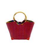 Betty Straw Bucket Bag with Bamboo Handles handmade loomed natural raffia palm fiber in a solid hue of umberwine burgundy/dark/purple/red with circular bamboo handles, leather feet, and colorful African Print wax cloth liner handbag purse tote - Shebobo