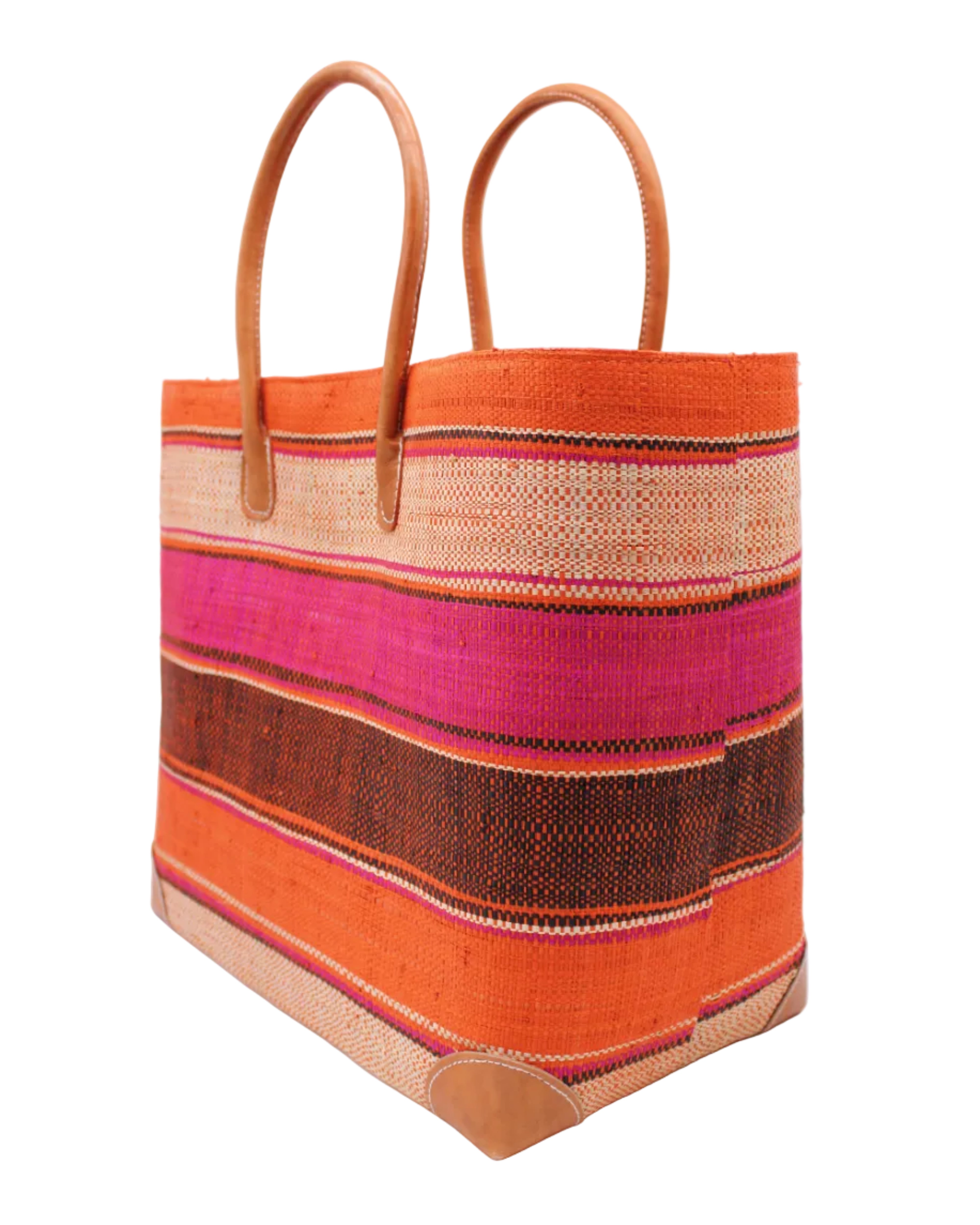 Side view Bolinas Whimsy Swirl XL Straw Basket Bag handmade loomed natural raffia palm fiber in a multicolor horizontal stripe pattern of multiple width bands of natural straw color, fuchsia hot/bright/barbie/pink, coral orange/red, black, etc. with leather handles and accents large tote bag shoulder bag handbag beach bag - Shebobo