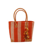 Bora Bora Coral Two Tone Stripes Straw Basket Bag with Waterfall Pompoms Charm Embellishment handmade loomed natural raffia palm fiber in a multicolor horizontal stripe pattern of even width wide bands of coral orange/red and natural straw color with leather handles and feet plus matching waterfall pompom charm embellishment handbag beach bag - Shebobo